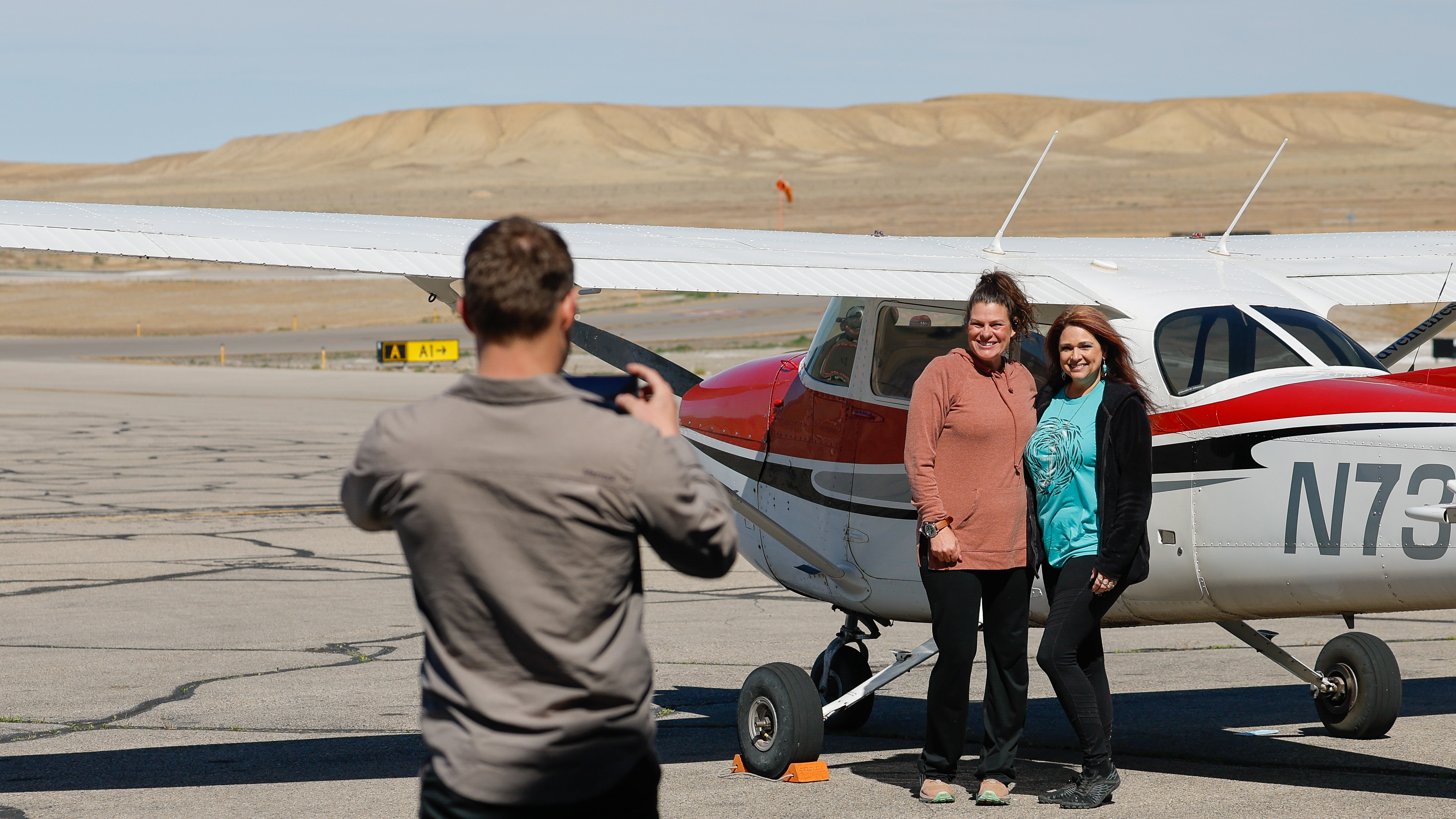 Happy tour passengers before a flight over the parks.