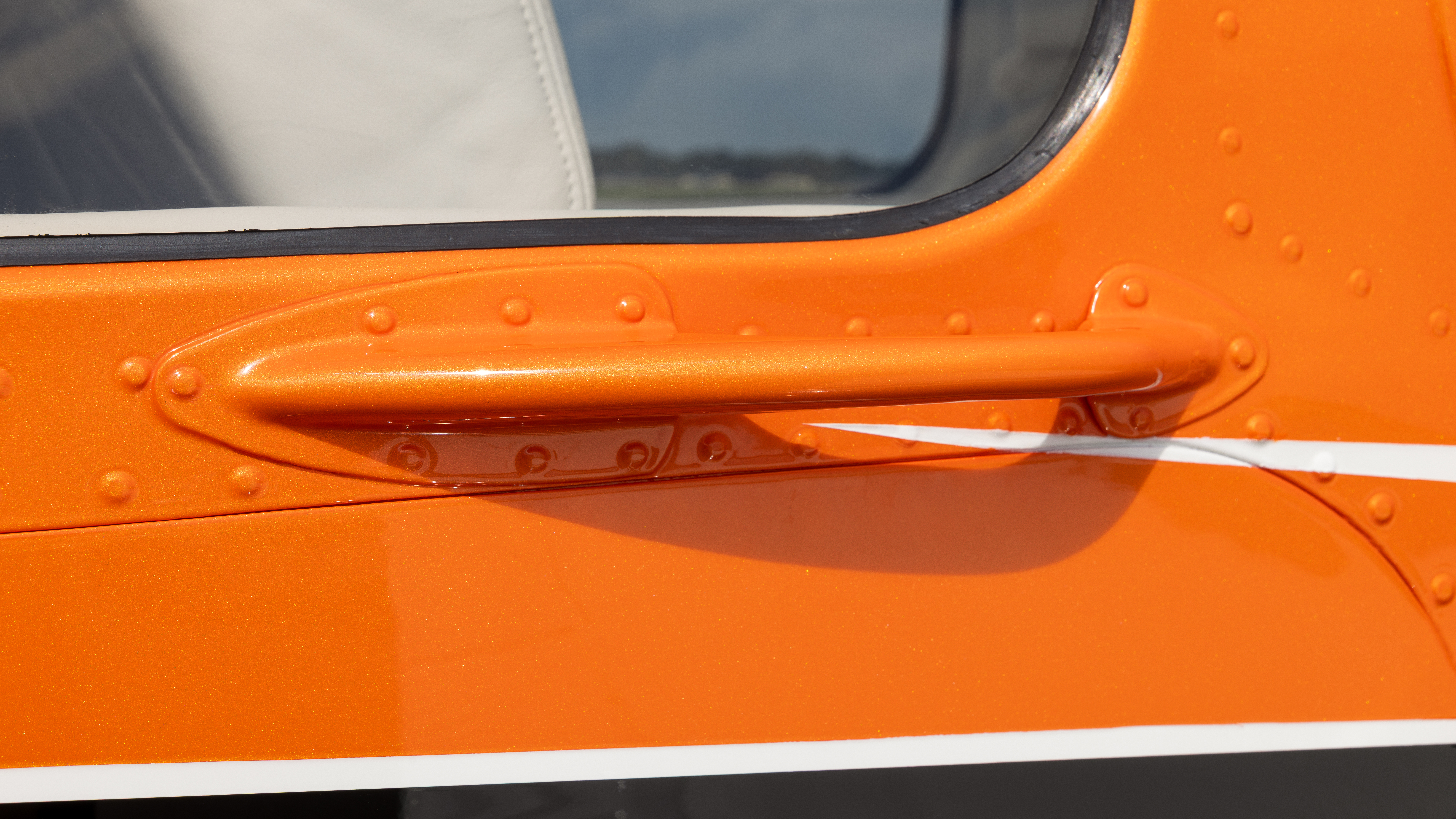 Orange paint makes the door handle pop.