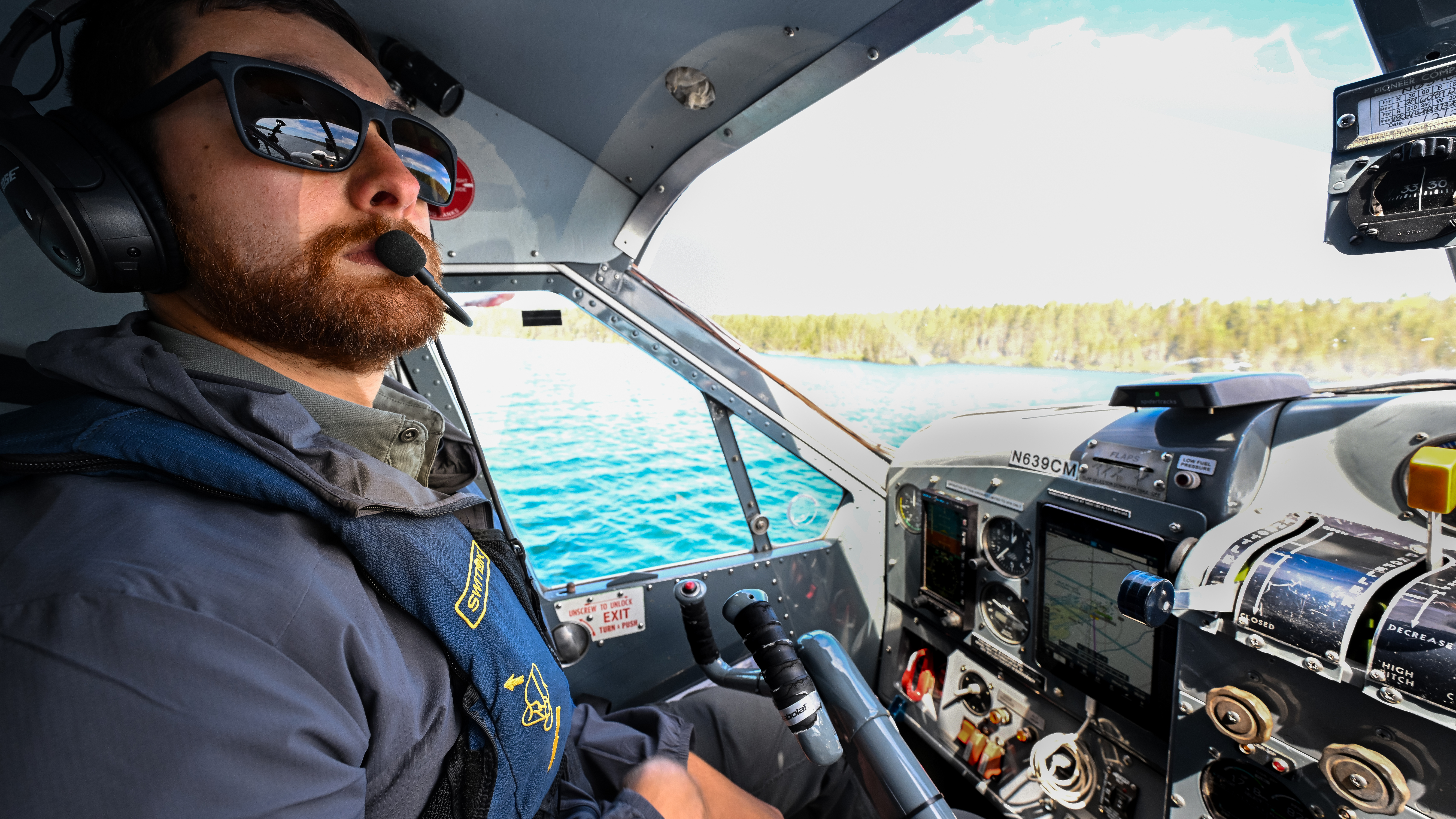 Seaplane pilot David Stawinski water taxis a Beaver from Isle Royale National Park.