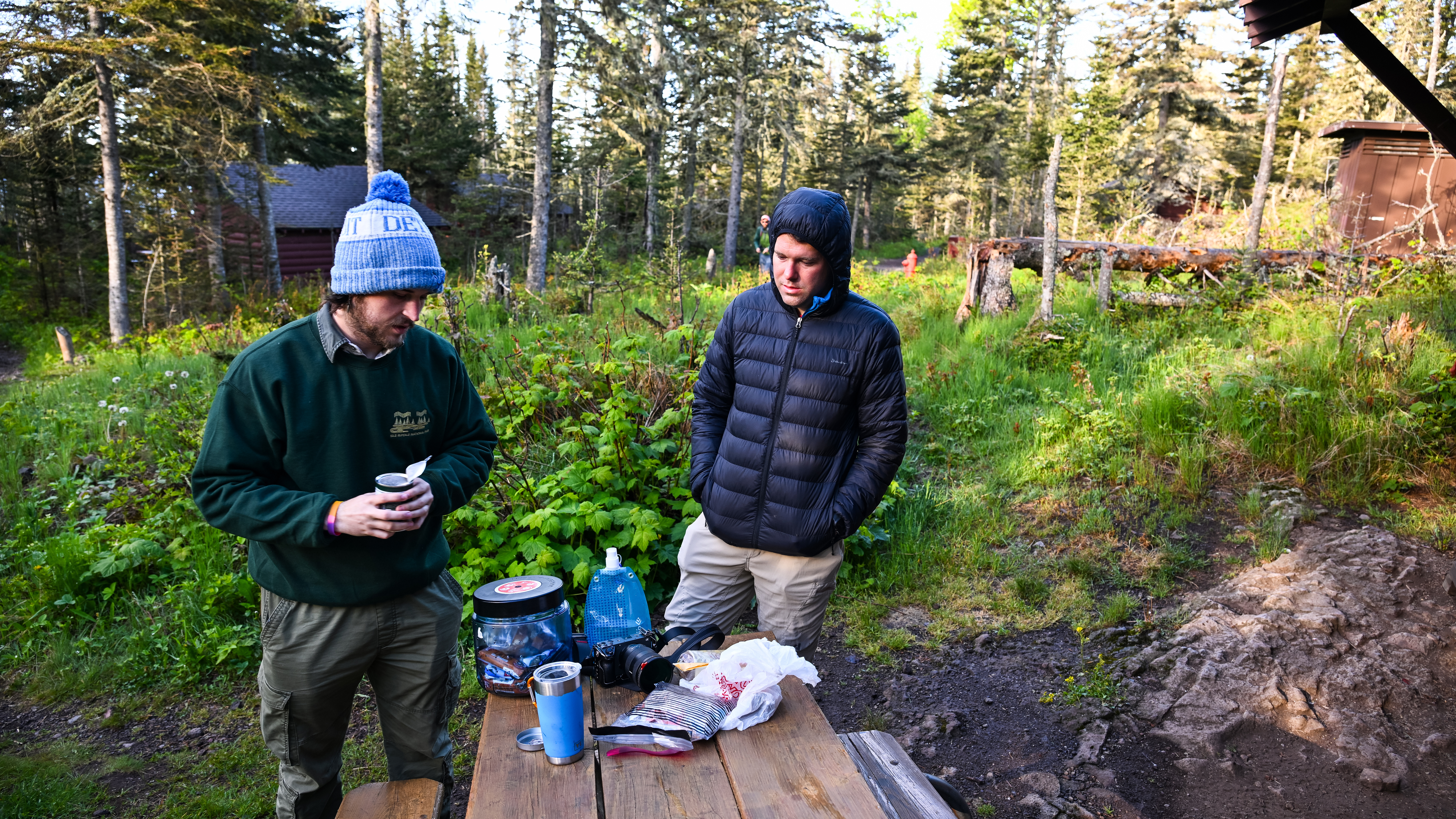 The author and AOPA Video Manager Josh Cochran contemplate a hot drink and a bite to eat near the camping cabins.