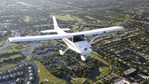 cessna flying over suburbs