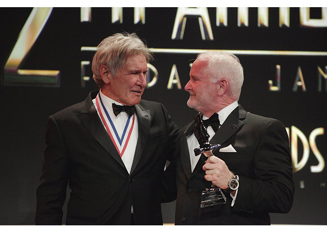 Harrison Ford presents what he called “the awkwardly named” Harrison Ford Legacy in Aviation Award to AOPA President Mark Baker. © 2015 Living Legends/Keren Fedida.