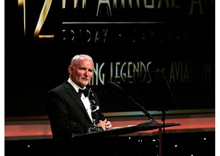 Mark Baker accepting the Harrison Ford Legacy in Aviation Award. © 2015 Living Legends/Steve Schapiro.