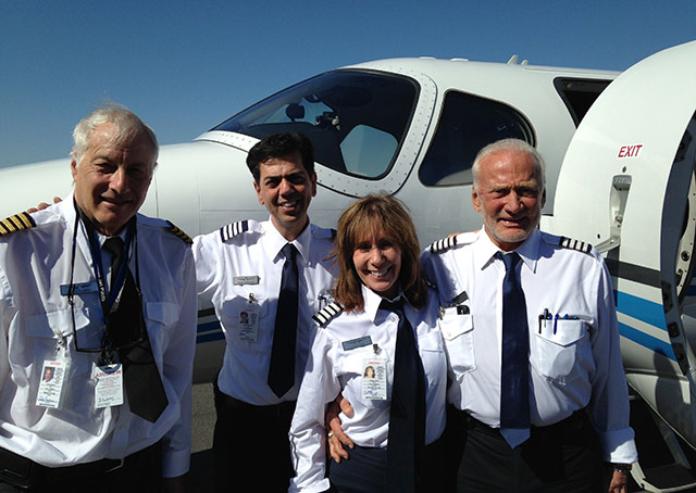 Think Global Flight Crew, left to right: Citation owners John Friedman and Edwin Sahakain; Capt Judy Rice and Dr. Buzz Aldrin